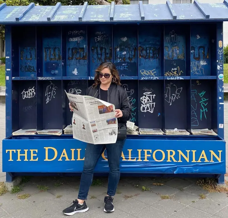 Marissa Vasquez with newspaper