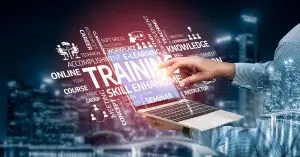 Person on a laptop computer with multiple words surrounding the screen