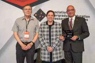 Left to right, Carl Wieman, Kathryn Chval, and Nikos Varelas